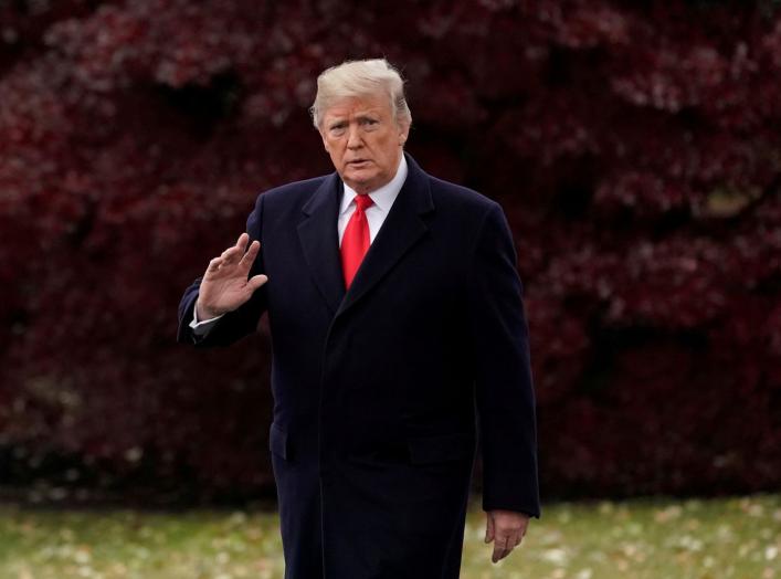 FILE PHOTO: U.S. President Donald Trump walks to board the Marine One helicopter to begin his travel to Mississippi from the White House in Washington, U.S. November 26, 2018. REUTERS/Jonathan Ernst/File Photo