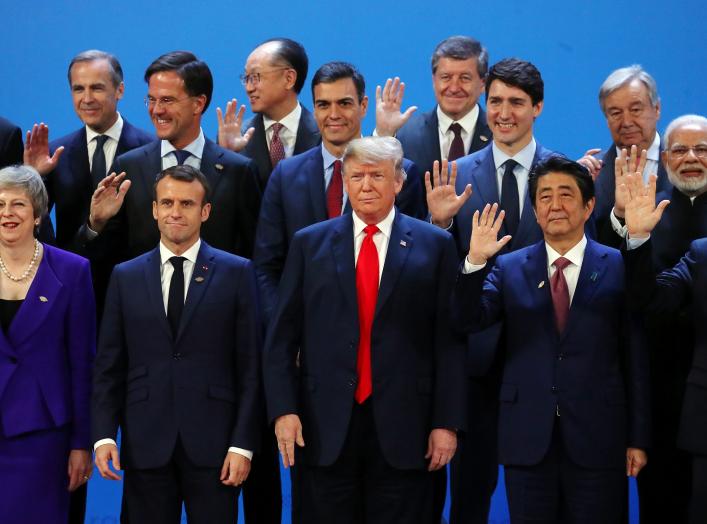 Britain's Prime Minister Theresa May, French President Emmanuel Macron, U.S. President Donald Trump, Japanese Prime Minister Shinzo Abe, Argentina's President Mauricio Macri and G20 leaders pose for a family photo during the G20 summit in Buenos Aires, Ar