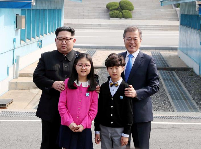 FILE PHOTO : South Korean President Moon Jae-in and North Korean leader Kim Jong Un attend a welcoming ceremony in the truce village of Panmunjom inside the demilitarized zone separating the two Koreas, South Korea, April 27, 2018. Korea Summit Press Pool