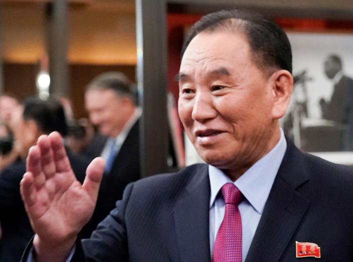 Vice Chairman of the North Korean Workers' Party Committee Kim Yong Chol, North Korea's lead negotiator in nuclear diplomacy with the United States, waves as he meets with U.S. Secretary of State Mike Pompeo (reflected in background 2ndL) for talks aimed 