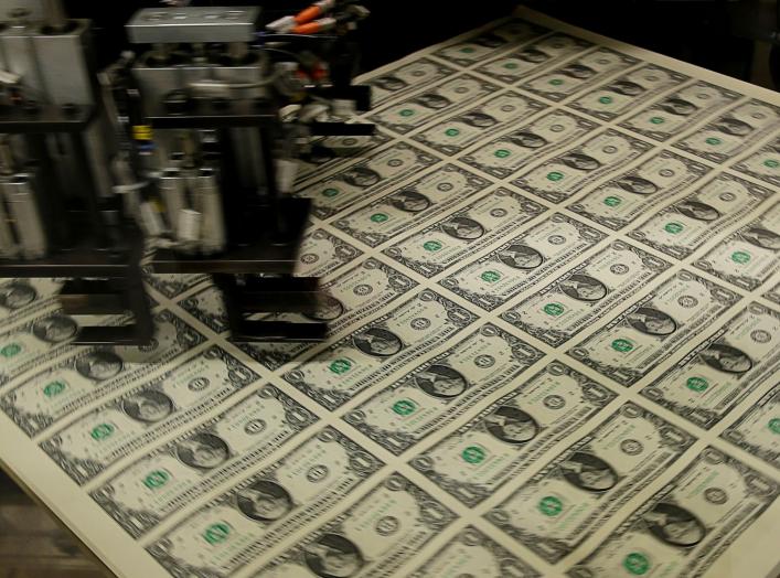 FILE PHOTO: United States one dollar bills get rotated before being cut into individual pieces during production at the Bureau of Engraving and Printing in Washington November 14, 2014. REUTERS/Gary Cameron/File Photo