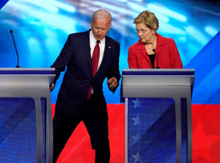 Former Vice President Joe Biden talks with Senator Elizabeth Warren during a break at the 2020 Democratic U.S. presidential debate in Houston, Texas, U.S. September 12, 2019. REUTERS/Mike Blake