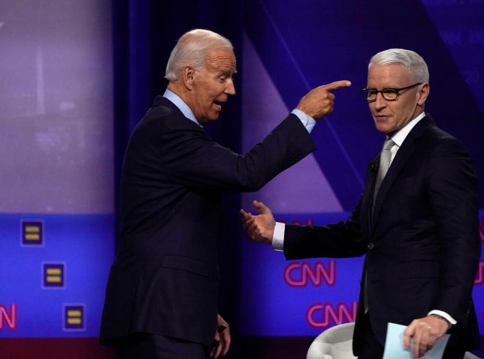 Democratic 2020 U.S. presidential candidate and former Vice President Joe Biden reacts next to moderator CNN's Anderson Cooper during a televised townhall on CNN dedicated to LGBTQ issues in Los Angeles, California, U.S. October 10, 2019. REUTERS/Mike Bla