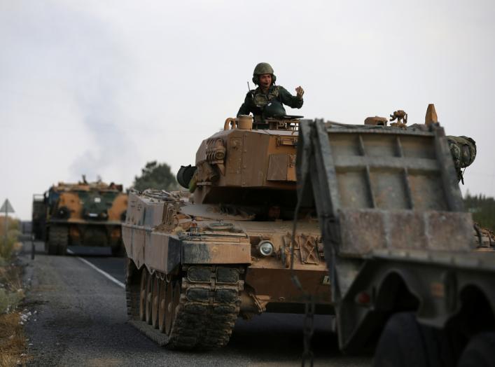 Turkish army vehicles are moving on a road near the Turkish border town of Ceylanpinar, Sanliurfa province, Turkey, October 18, 2019. REUTERS/Stoyan Nenov