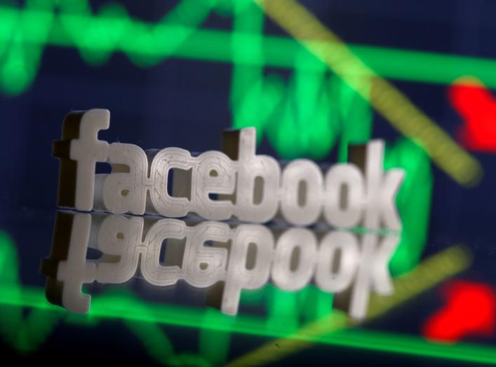 A 3D-printed Facebook logo is seen in front of displayed stock graph in this illustration photo, March 20, 2018. Picture taken March 20. REUTERS/Dado Ruvic