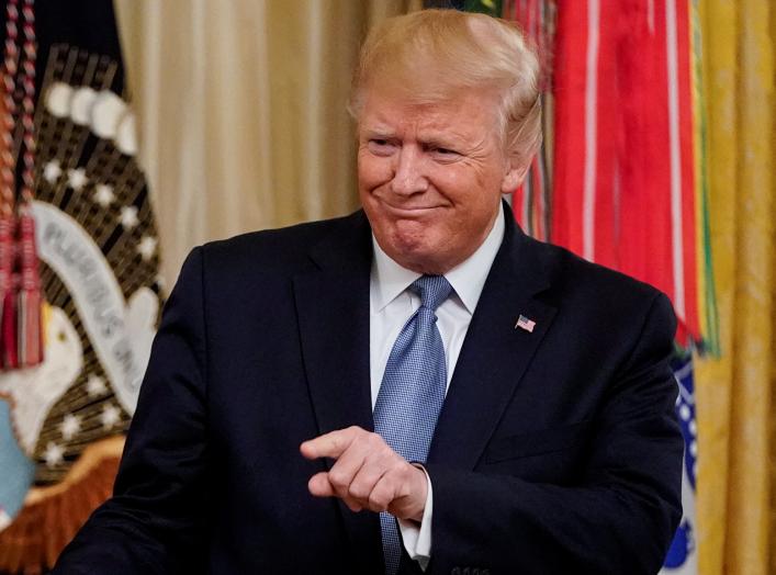 U.S. President Donald Trump acknowledges a guest during a Medal of Honor ceremony in the East Room of the White House in Washington, U.S., October 30, 2019. REUTERS/Joshua Roberts