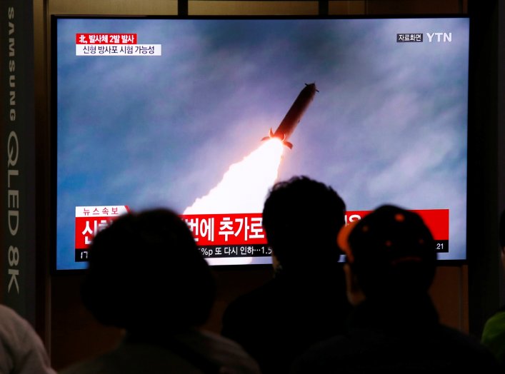 People watch a TV broadcast showing a file footage for a news report on North Korea firing two projectiles, possibly missiles, into the sea between the Korean peninsula and Japan, in Seoul, South Korea, October 31, 2019. REUTERS/Heo Ran