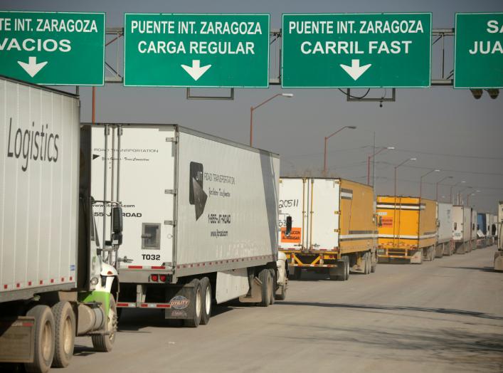 Trucks wait in a queue for border customs control, to cross into the U.S., at the Zaragoza-Ysleta border crossing bridge in Ciudad Juarez, Mexico December 12, 2019. REUTERS/Jose Luis Gonzalez