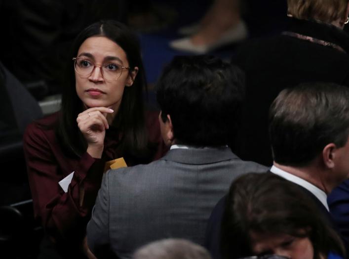 Rep. Alexandria Ocasio-Cortez reacts after voting on two articles of impeachment against U.S. President Donald Trump at the U.S. Capitol in Washington, U.S., December 18, 2019. REUTERS/Jonathan Ernst