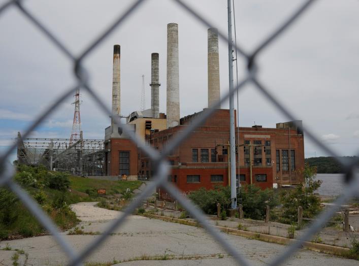 FILE PHOTO: A fence closes off the closed coal-fired Somerset power plant in Somerset, Massachusetts, U.S., June 7, 2017. REUTERS/Brian Snyder/File Photo