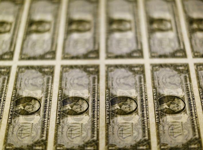 United States one dollar bills are seen on a light table at the Bureau of Engraving and Printing in Washington in this November 14, 2014, file photo. Dollar bulls were on the defensive on March 30, 2016 after Federal Reserve chair Janet Yellen's cautious 