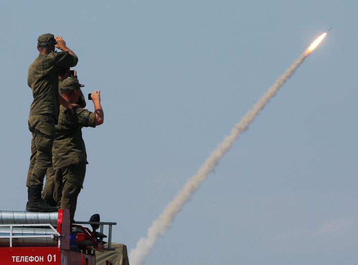 Russian servicemen watch the launch of the S-300 air defence system missile during the International Army Games 2016 at the Ashuluk military polygon outside Astrakhan, Russia, August 7, 2016. REUTERS/Maxim Shemetov