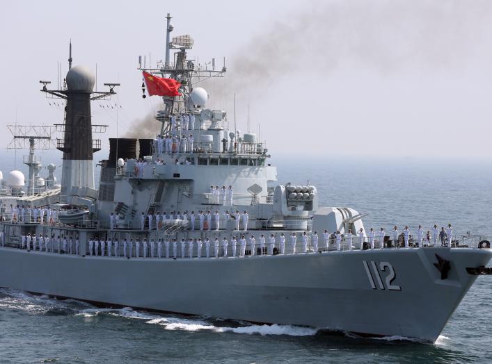 Chinese servicemen gesture from the deck of a naval vessel, during the closing ceremony of the Pakistan Navy’s Multinational Exercise AMAN-17, in the North Arabian Sea, Pakistan, February 14, 2017. REUTERS/Akhtar Soomro