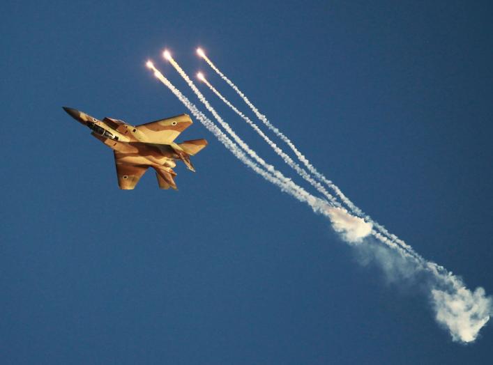 An Israeli air force F-15I fighter jet releases flares during an air force pilots' graduation ceremony at Hatzerim air base in southern Israel June 27, 2013. Some 30 cadets graduated on Thursday where they were addressed by Israel's Prime Minister Benjami