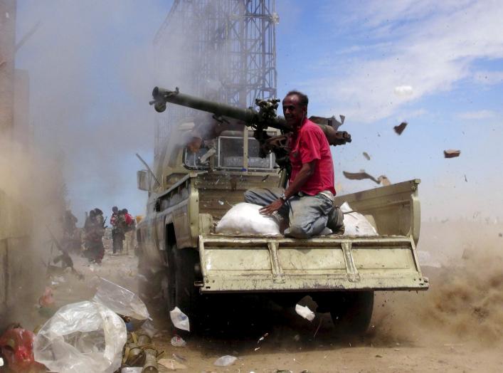 A Southern Popular Resistance fighter fires a weapon mounted on a truck during clashes with Houthi fighters in Yemen's southern city of Aden May 3, 2015. Between 40-50 Arab special forces soldiers arrived in Aden on Sunday and deployed alongside local fig