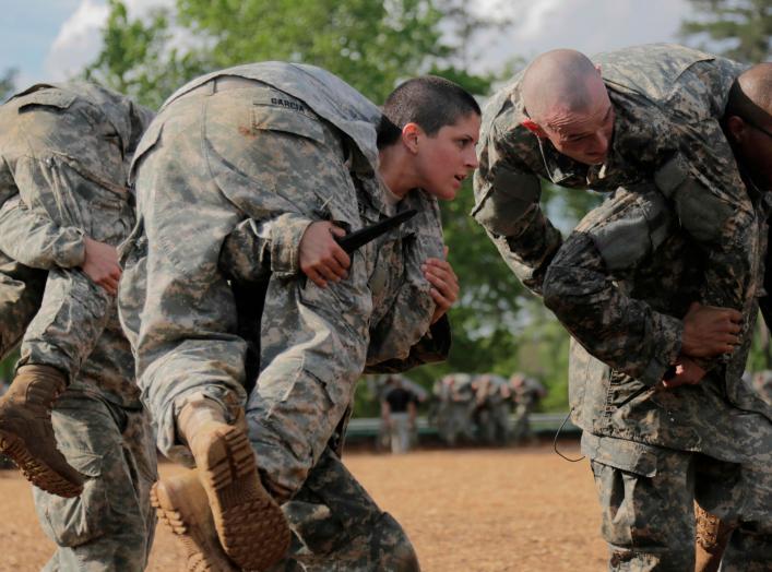 Then U.S. Army First Lieutenant Kirsten Griest (C) and fellow soldiers participate in combatives training during the Ranger Course on Fort Benning, Georgia, in this handout photograph taken on April 20, 2015 and obtained on August 20, 2015. When Griest an