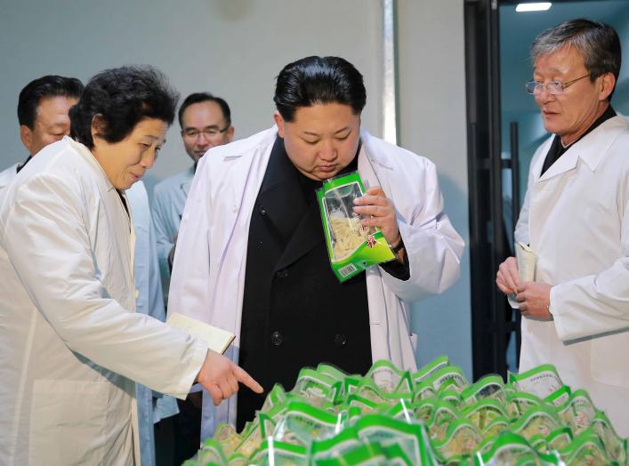 North Korean leader Kim Jong Un (C) visits the Kumkop General Foodstuff Factory for Sportspersons in this undated photo released by North Korea's Korean Central News Agency (KCNA) in Pyongyang January 23, 2016.