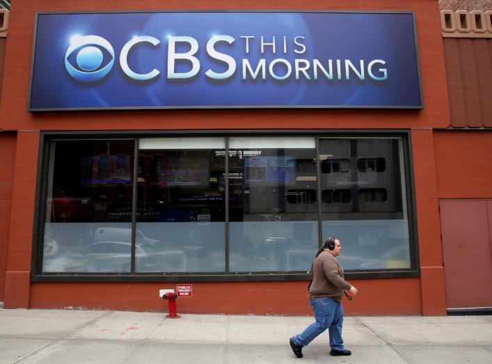 A man walks past the CBS News studios at the CBS Broadcast Center on West 57th St. in Manhattan, New York, U.S., April 29, 2016. REUTERS/Brendan McDermid