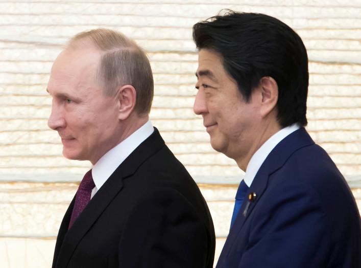 Vladimir Putin, Russia's president, and Shinzo Abe, Japan's prime minister, arrive for a working lunch at the prime minister's official residence in Tokyo, Japan, on Friday, Dec. 16, 2016. REUTERS/Tomohiro Ohsumi/Pool