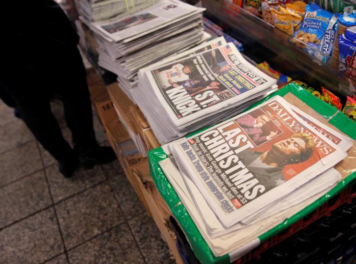 A newstand sells newspapers featuring the image of late singer George Michael in Manhattan, New York City, U.S., December 26, 2016. REUTERS/Andrew Kelly