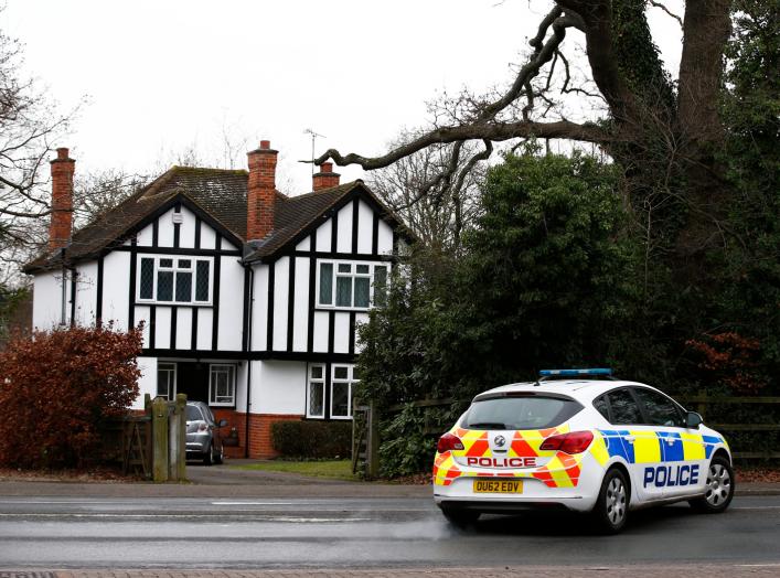 A police car drives past an address which has been linked by local media to former British intelligence officer Christopher Steele, who has been named as the author of an intelligence dossier on President-elect Donald Trump, in Wokingham, Britain, January