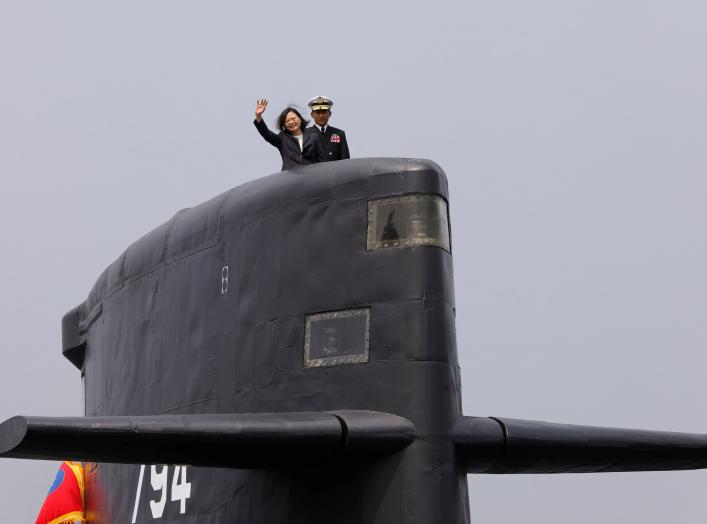 Taiwan President Tsai Ing-wen waves as she boards Hai Lung-class submarine (SS-794) during her visit to a navy base in Kaohsiung, Taiwan March 21, 2017. REUTERS/Tyrone Siu TPX IMAGES OF THE DAY