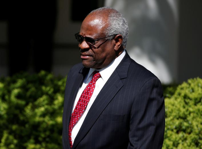 Associate Supreme Court Justice Clarence Thomas arrives for the swearing in ceremony of Judge Neil Gorsuch as an Associate Supreme Court Justice in the Rose Garden of the White House in Washington, U.S., April 10, 2017. REUTERS/Joshua Roberts