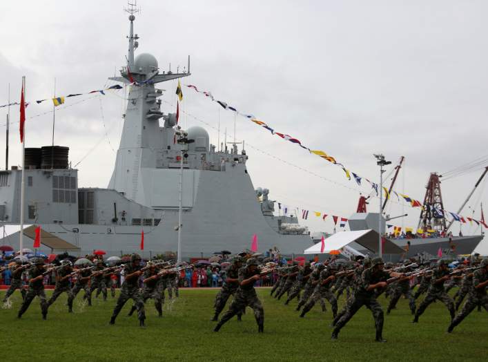 People's Liberation Army Navy soldiers perform in front of destroyer Yinchuan at a naval base in Hong Kong, China July 8, 2017. REUTERS/Bobby Yip