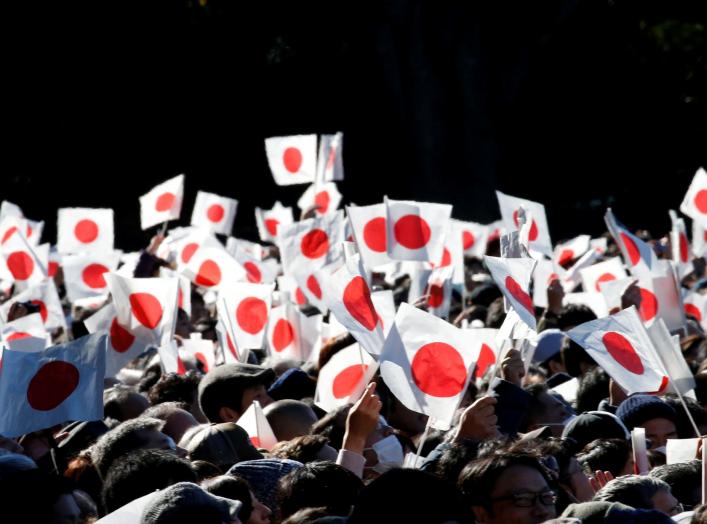 Well-wishers wave Japanese national flags as Japan's Emperor Akihito (not pictured) appears on a balcony of the Imperial Palace during a public appearance for New Year celebrations at the Imperial Palace in Tokyo, Japan, January 2, 2018. REUTERS/Toru Hana