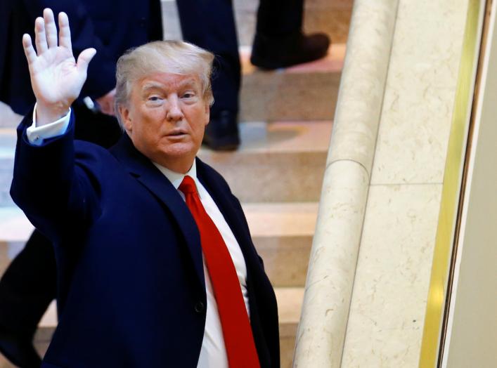 U.S. President Donald Trump waves as he arrives at the World Economic Forum (WEF) annual meeting in Davos, Switzerland January 26, 2018. REUTERS/Denis Balibouse