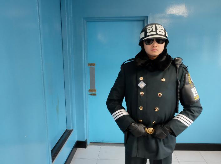 South Korean soldiers stand guard in the demilitarized zone separating the two Koreas, in the truce village of Panmunjom, South Korea February 7, 2018. Picture taken on February 7, 2018. REUTERS/Josh Smith