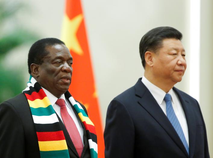 Chinese President Xi Jinping and President of Zimbabwe Emmerson Mnangagwa attend a welcoming ceremony before talks at the Great Hall of the People in Beijing, China April 3, 2018. REUTERS/Thomas Peter