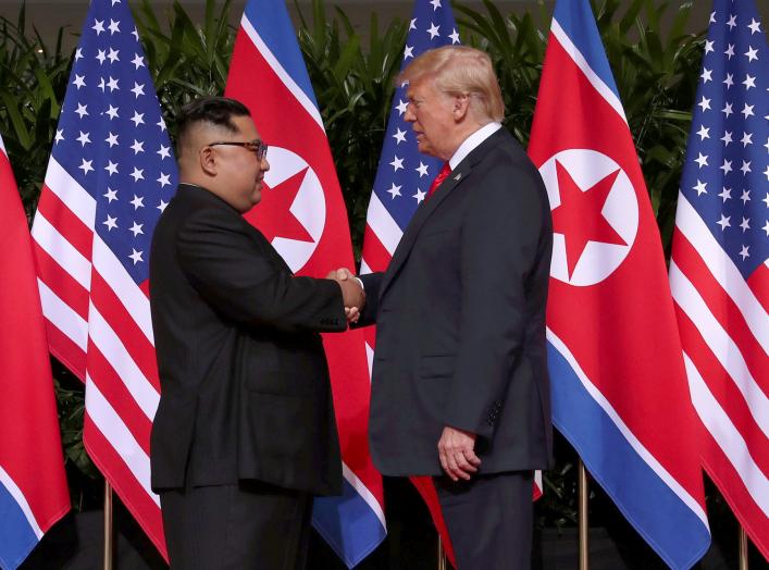 U.S. President Donald Trump shakes hands with North Korean leader Kim Jong Un at the Capella Hotel on Sentosa island in Singapore June 12, 2018. REUTERS/Jonathan Ernst