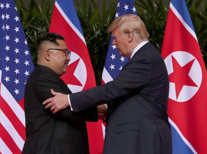 U.S. President Donald Trump shakes hands with North Korean leader Kim Jong Un at the Capella Hotel on Sentosa island in Singapore June 12, 2018. REUTERS/Jonathan Ernst TPX IMAGES OF THE DAY