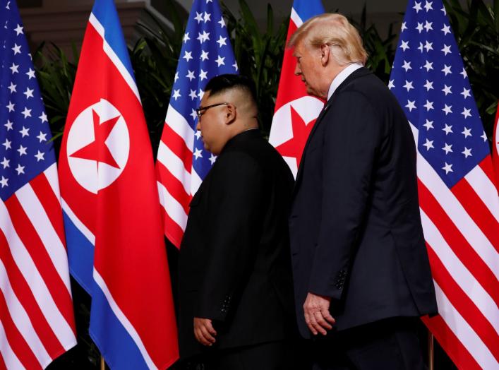 U.S. President Donald Trump and North Korea's leader Kim Jong Un hold a summit at the Capella Hotel on the resort island of Sentosa, Singapore June 12, 2018. REUTERS/Jonathan Ernst