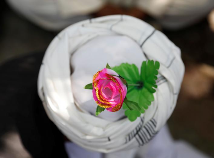 An artificial flower is seen on a turban of a peace marcher as he arrives in Kabul, Afghanistan June 18, 2018. REUTERS/Mohammad Ismail