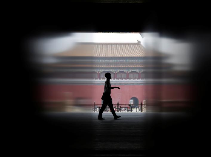 A security guard walks at the Gate of Supreme Harmony, in a part where it is closed for a major renovation work, at the Forbidden City in central Beijing, China July 31, 2018. REUTERS/Jason Lee