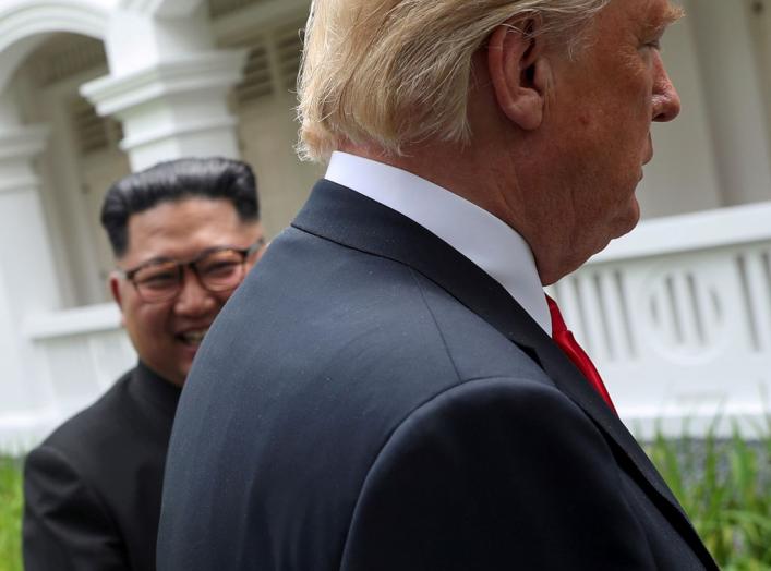 U.S. President Donald Trump and North Korea's leader Kim Jong Un walk together before their working lunch during their summit at the Capella Hotel on the resort island of Sentosa, Singapore, June 12, 2018. Reuters photographer Jonathan Ernst: "On a histor