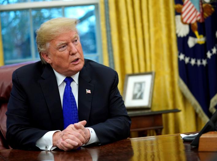 FILE PHOTO: U.S. President Donald Trump sits for an exclusive interview with Reuters journalists in the Oval Office at the White House in Washington, U.S. December 11, 2018. REUTERS/Jonathan Ernst/File Photo