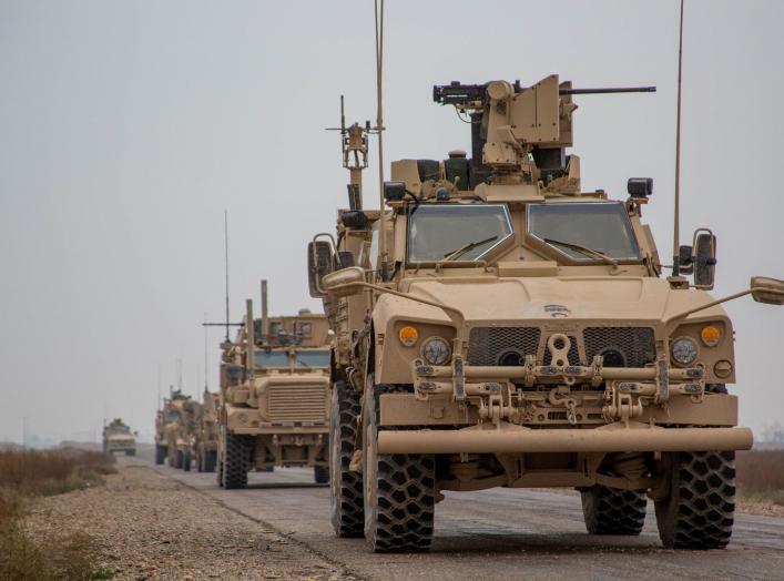 A Coalition convoy of U.S. led international coalition against the Islamic State of Iraq and the Levant (ISIL) stops to test fire their M2 machine guns and MK19 grenade launcher in the Middle Euphrates River Valley in the Deir ez-Zor province, Syria, Nove