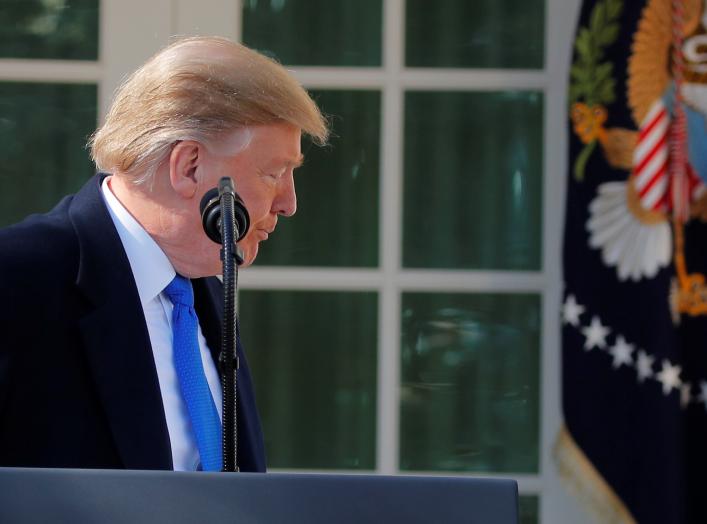 U.S. President Donald Trump leaves the podium and heads back to the Oval Office after declaring a national emergency at the U.S.-Mexico border during remarks about border security in the Rose Garden of the White House in Washington, U.S., February 15, 201