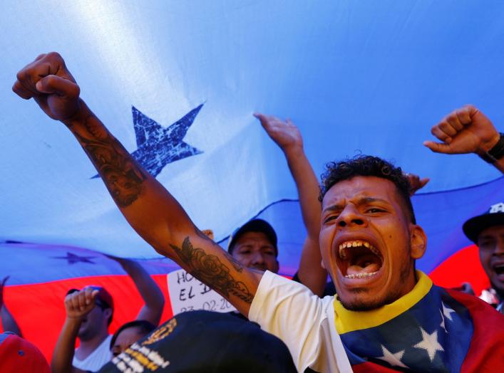 Supporters of the Venezuelan opposition leader Juan Guaido, who many nations have recognized as the country's rightful interim ruler, take part in a rally to demand President Nicolas Maduro to allow humanitarian aid to enter the country, in Caracas, Venez