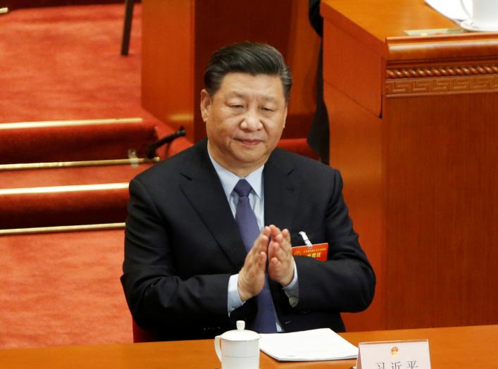 Chinese President Xi Jinping claps his hands at the second plenary session of the National People's Congress (NPC) at the Great Hall of the People in Beijing, China March 8, 2019. REUTERS/Thomas Peter