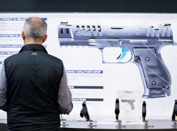 A man inspects handguns inside of the Walther booth during the National Rifle Association (NRA) annual meeting in Indianapolis, Indiana, U.S., April 28, 2019. REUTERS/Lucas Jackson