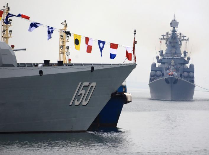 Russia Navy's guided missile cruiser Varyag (R) arrives for the Chinese-Russian joint naval exercise, near a guided missile destroyer Changchun (DDG150) of Chinese People's Liberation Army (PLA) Navy, at Dagang port, in Qingdao, Shandong province, China A