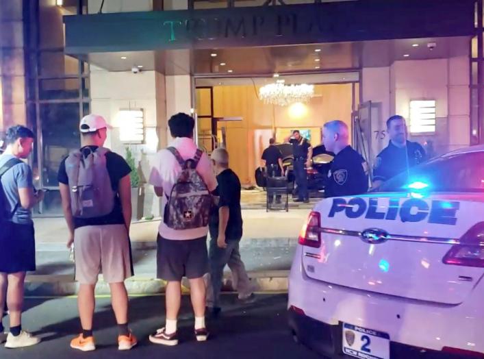 People and police officers stand outside Trump Plaza after a car crashed into the building's lobby in New Rochelle, New York, U.S., September 17, 2019, in this still image from video obtained via social media. Jose Abarca via REUTERS