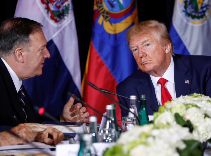 U.S. President Donald Trump confers with U.S. Secretary of State Mike Pompeo during a multilateral meeting with Western Hemisphere leaders about Venezuela during the 74th session of the United Nations General Assembly (UNGA) at U.N. headquarters.