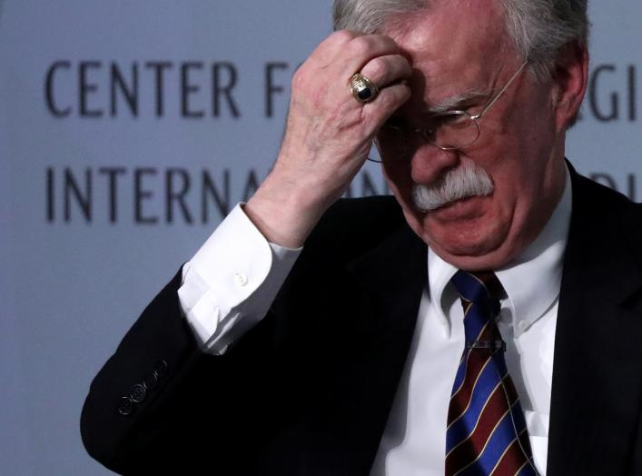 White House former National Security Advisor John Bolton fixes his hair and listens to a question after his remarks on North Korea at the Center for Strategic and International Studies (CSIS) think tank in Washington, U.S. September 30, 2019.