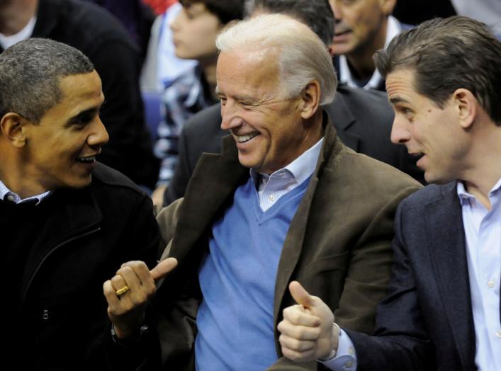 U.S. President Barack Obama, Vice President Joe Biden and his son Hunter Biden attend an NCAA basketball game between Georgetown University and Duke University in Washington, U.S., January 30, 2010. Picture taken January 30, 2010. REUTERS/Jonathan Ernst