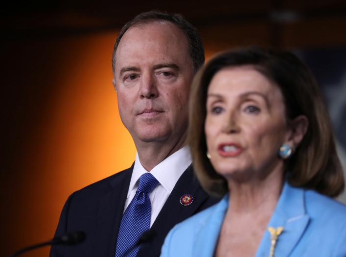 U.S. House Speaker Nancy Pelosi (D-CA) addresses reporters as House Intelligence Committee Chairman Adam Schiff (D-CA) looks on during Pelosi's weekly news conference at the U.S. Capitol in Washington, U.S., October 2, 2019. REUTERS/Jonathan Ernst